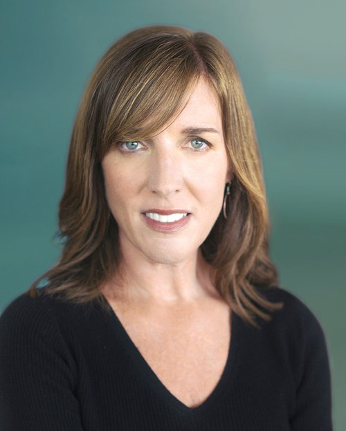 Portrait of Molly Watkins wearing a black, V-neck sweater